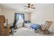 Comfortable secondary bedroom with natural light and ceiling fan at 2706 Cranmoor Dr, Kissimmee, FL 34758