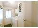 Laundry room with washer, dryer and exterior door offering natural light at 2706 Cranmoor Dr, Kissimmee, FL 34758