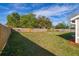 Expansive backyard featuring a privacy fence, green grass, and a well-maintained lawn at 2740 Courtland Blvd, Deltona, FL 32738