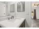 Bathroom with a sleek white countertop and views of a bedroom with wood-look flooring at 2740 Courtland Blvd, Deltona, FL 32738