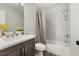 Bright bathroom featuring a tub with shower, modern vanity and mirror at 2740 Courtland Blvd, Deltona, FL 32738