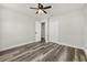 Bedroom featuring new vinyl flooring, a ceiling fan, and a double door closet at 2740 Courtland Blvd, Deltona, FL 32738