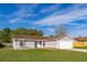 Charming single-story home featuring a well-manicured lawn and an attached two-car garage at 2740 Courtland Blvd, Deltona, FL 32738