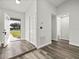 Bright foyer with closet, light gray wood-look flooring, and an open entry at 2740 Courtland Blvd, Deltona, FL 32738