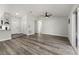 Open concept living room with hard surface floors, a ceiling fan, and lots of natural light at 2740 Courtland Blvd, Deltona, FL 32738