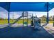 Community playground with shade featuring a slide, climbing structure, and soft ground at 2740 Courtland Blvd, Deltona, FL 32738