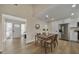 The dining area flows into the foyer and kitchen, features laminate flooring and modern decorative features at 277 Sandpiper Dr, Casselberry, FL 32707