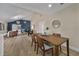 Inviting dining area flowing into a stylish living room with vaulted ceilings and a striking accent wall at 277 Sandpiper Dr, Casselberry, FL 32707