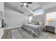 Vaulted ceiling bedroom featuring a large arched window and neutral color scheme at 2902 Egrets Landing Dr, Lake Mary, FL 32746