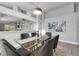 Dining room featuring a glass-top table with seating for six, modern decor, and an open layout at 2902 Egrets Landing Dr, Lake Mary, FL 32746