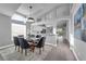 Dining area with a modern glass table, comfortable seating, recessed lighting, and an open view to the kitchen at 2902 Egrets Landing Dr, Lake Mary, FL 32746