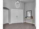 Front entryway featuring double doors, round mirror, and marble and gold table at 2902 Egrets Landing Dr, Lake Mary, FL 32746