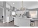 Bright kitchen featuring an island with marble countertop, modern lighting, and stainless steel appliances at 2902 Egrets Landing Dr, Lake Mary, FL 32746