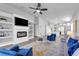 Stylish living room featuring a fireplace, built-in shelves, and contemporary furnishings with neutral tones and blue accents at 2902 Egrets Landing Dr, Lake Mary, FL 32746