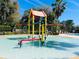 Community splash pad featuring colorful play structures and a shallow pool for Gathering fun at 2902 Egrets Landing Dr, Lake Mary, FL 32746