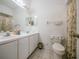 Bathroom offers double sinks, a large mirror, and a shower/tub combination at 3100 Tall Grass Pl, Kissimmee, FL 34743