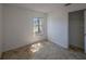 Bedroom with tile flooring, window overlooking backyard and lake, and closet at 3100 Tall Grass Pl, Kissimmee, FL 34743