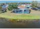 Enjoy the screened-in pool with views of the lake in this lovely home at 3100 Tall Grass Pl, Kissimmee, FL 34743