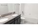 Neutral colored bathroom with modern fixtures and a tiled tub/shower combo at 3108 Dark Sky Drive, Harmony, FL 34773