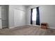 Neutral bedroom with carpet, closet, a single window, and small side table at 3108 Dark Sky Drive, Harmony, FL 34773