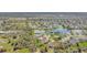 Breathtaking aerial view of a home nestled in a community with a lake and mature landscaping at 3172 Bayview Ln, St Cloud, FL 34772