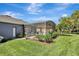 A tranquil and serene backyard with a sparkling pool, and lush greenery surrounds the space at 3172 Bayview Ln, St Cloud, FL 34772