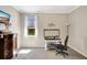 Bright bedroom with neutral walls, carpet, and a desk area at 3172 Bayview Ln, St Cloud, FL 34772