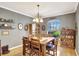 Charming dining room featuring hardwood floors, elegant decor, and a cozy ambiance at 3172 Bayview Ln, St Cloud, FL 34772