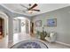 Inviting foyer with a decorative rug, comfortable seating, and elegant artwork, leading to the front door at 3172 Bayview Ln, St Cloud, FL 34772