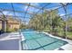 Sparkling screened pool with sun-shelf, lounge chairs and a covered lanai offer the best in outdoor living at 3172 Bayview Ln, St Cloud, FL 34772