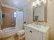 Bathroom featuring a shower-tub combo, mirror, and white vanity at 320 Lakeview St # 316, Orlando, FL 32804