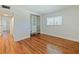 Bedroom featuring closet, hardwood floors, and a window at 320 Lakeview St # 316, Orlando, FL 32804