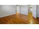 Bedroom featuring closet with white cabinets and drawers, hardwood floors, and white walls at 320 Lakeview St # 316, Orlando, FL 32804