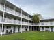 Exterior view showcasing property's balconies overlooking landscaped courtyard and green space at 320 Lakeview St # 316, Orlando, FL 32804