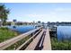 Wooden dock overlooking lake and city skyline, creating a peaceful setting at 320 Lakeview St # 316, Orlando, FL 32804