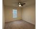 A bright bedroom featuring a ceiling fan and a window with blinds at 3942 Green Sabal Dr, Orlando, FL 32824