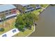 Aerial view of waterfront condo with lush landscaping and community dock at 415 N Halifax Ave # 216, Daytona Beach, FL 32118