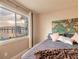 Bedroom featuring water view, world map and welcoming decor at 415 N Halifax Ave # 216, Daytona Beach, FL 32118