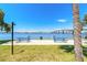 Relaxing community park with blue picnic tables, offering a picturesque waterfront vista and serene atmosphere at 415 N Halifax Ave # 216, Daytona Beach, FL 32118