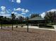 Community playground area with swings, a covered picnic shelter and seating for outdoor recreation and relaxation at 4407 Lake Lawne Ave, Orlando, FL 32808