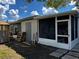 Enclosed sunroom features screened windows, plenty of storage, and a door leading to the outside at 4407 Lake Lawne Ave, Orlando, FL 32808