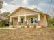 Charming single-story home with a welcoming front porch supported by columns with brick accents at 532 W Park St, Lakeland, FL 33803