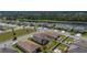 Aerial view of a suburban house with a large backyard and a lake view at 5607 Western Sky Pl, St Cloud, FL 34771