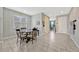 Dining area adjacent to the kitchen, features a round table, tile floors and natural light at 5607 Western Sky Pl, St Cloud, FL 34771