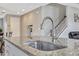 Close-up of kitchen island featuring a large sink and granite countertops at 5607 Western Sky Pl, St Cloud, FL 34771