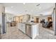 Kitchen and great room featuring a granite island, recessed lights, and modern stainless steel appliances at 5607 Western Sky Pl, St Cloud, FL 34771