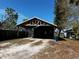 Large carport offers ample parking with room for storage or outdoor activities at 586 N 8Th St, Eagle Lake, FL 33839