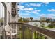 Relaxing balcony with a comfortable chair and stunning views of the lake and surrounding cityscape at 6165 Carrier Dr # 1504, Orlando, FL 32819