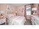 Adorable bedroom featuring a pink theme, decorative art, and plenty of natural light at 7388 Capstone Dr, Groveland, FL 34736