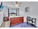 Bedroom featuring a writing desk, wood furnishings and TV at 758 Orchid Dr, Davenport, FL 33897